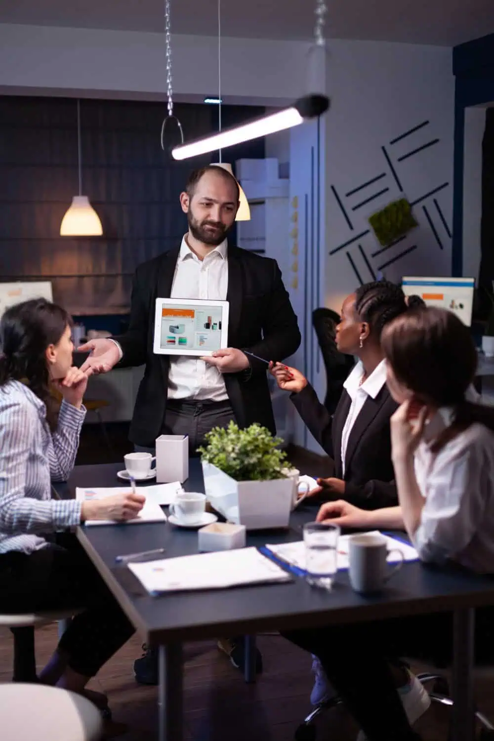 Man presenting client performance and stats