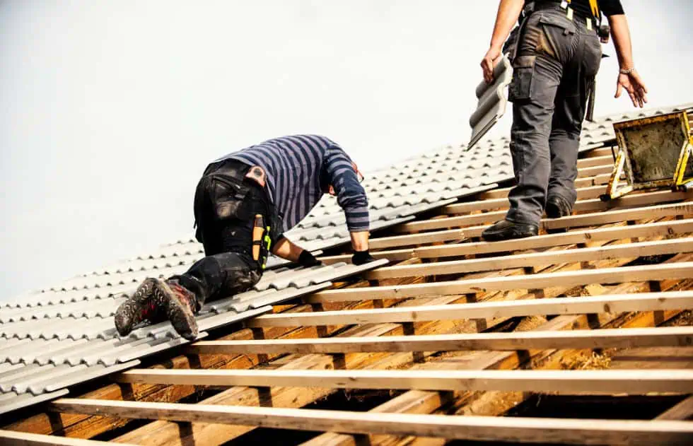 roof workers installing tiles