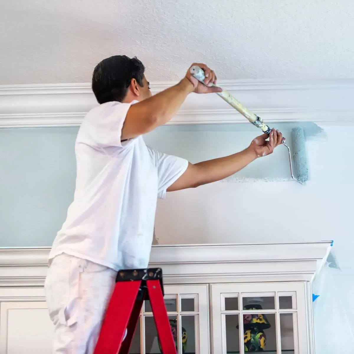 Man painting a wall